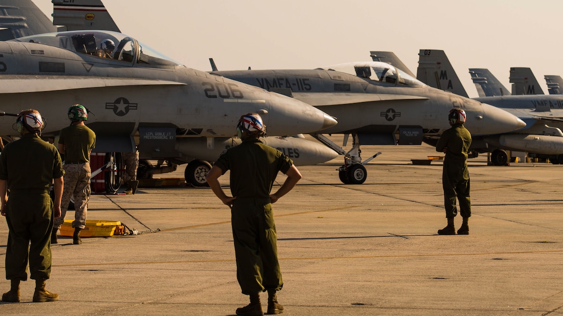 Marines prepare F/A-18C Hornets to take off from Marine Corps Air Station Beaufort to during Exercise Sentry Savannah 2015, Aug. 21. Several squadrons from Marine Corps Air Station Beaufort, including Marine Fighter Attack Squadron 115 flew training exercises for Sentry Savannah. The Marines are with Marine Fighter Attack Squadron 115, Marine Aircraft Group 31.