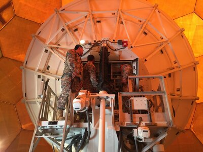 KYOGAMISAKI, Japan (Aug. 25, 2015) - Signal Soldiers from the 94th Army Air and Missile Defense Command, 78th Network Enterprise Center, and the 307th Expeditionary Signal Battalion work on enhancing the ability of the 14th Missile Defense Battery, 94th AAMDC to communicate with their higher headquarters and transmit accurate missile defense data to meet their regional and homeland defense missions.  