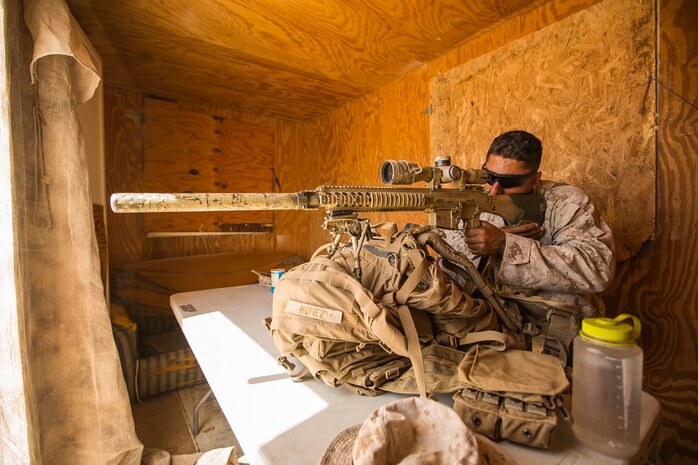 U.S. Marine Corps Lance Cpl. Jhovanng Nunez with Company A, 1st Battalion, 7th Marine Regiment, conducts simulated overwatch procedures during security force operations as a part of Large Scale Exercise (LSE) at Marine Corps Air Ground Combat Center Twentynine Palms, Calif., Aug. 18, 2015. LSE is a joint forces exercise conducted at the brigade level designed to enable live, virtual, and constructive training for participating units and allows participating nations to strengthen partnerships and their ability to operate together. (U.S. Marine Corps photo by Lance Cpl. Clarence A. Leake/Released)
