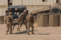 U.S. Marines with Company A, 1st Battalion, 7th Marine Regiment, conduct a simulated casualty evacuation during  security force operations as a part of Large Scale Exercise (LSE) at Marine Corps Air Ground Combat Center Twentynine Palms, Calif., Aug. 19, 2015. LSE is a joint forces exercise conducted at the brigade level designed to enable live, virtual, and constructive training for participating units and allows participating nations to strengthen partnerships and their ability to operate together. (U.S. Marine Corps photo by Lance Cpl. Clarence A. Leake/Released)