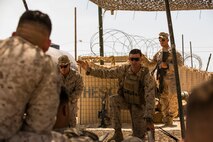 U.S. Marine Corps 1st Lt. Brandon Recker, platoon commander, Company A, 1st Battalion, 7th Marine Regiment, describes the importance of security force operations during part of Large Scale Exercise (LSE) at Marine Corps Air Ground Combat Center Twentynine Palms, Calif., Aug. 18, 2015. LSE is a joint forces exercise conducted at the brigade level designed to enable live, virtual, and constructive training for participating units and allows participating nations to strengthen partnerships and their ability to operate together. (U.S. Marine Corps photo by Lance Cpl. Clarence A. Leake/Released)