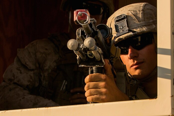 U.S. Marine Corps Pfc. Vincent Barggesgard with Company A, 1st Battalion, 7th Marine Regiment, provides security while conducting security force operations as a part of Large Scale Exercise (LSE) at Marine Corps Air Ground Combat Center Twentynine Palms, Calif., Aug. 18, 2015. LSE is a joint forces exercise conducted at the brigade level designed to enable live, virtual, and constructive training for participating units and allows participating nations to strengthen partnerships and their ability to operate together. (U.S. Marine Corps photo by Lance Cpl. Clarence A. Leake/Released)