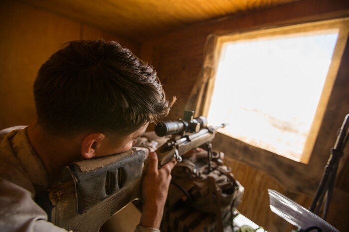 U.S. Marine Corps Lance Cpl. Joey Landcaster with Company A, 1st Battalion, 7th Marine Regiment, conducts simulated overwatch procedures during security force operations as a part of Large Scale Exercise (LSE) at Marine Corps Air Ground Combat Center Twentynine Palms, Calif., Aug. 18, 2015. LSE is a joint forces exercise conducted at the brigade level designed to enable live, virtual, and constructive training for participating units and allows participating nations to strengthen partnerships and their ability to operate together. (U.S. Marine Corps photo by Lance Cpl. Clarence A. Leake/Released)