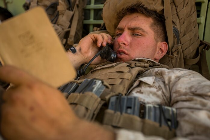 U.S. Marine Corps Cpl. Justen Petet, an 81mm mortar forward observer with Company C, 1st Battalion, 7th Marine Regiment, radios grid coordinates to adjacent units before conducting fire integration support team (FiST) exercise as a part of Large Scale Exercise (LSE) at Marine Corps Air Ground Combat Center Twentynine Palms, Calif., Aug.  16, 2015. LSE is a joint forces exercise conducted at the brigade level designed to enable live, virtual, and constructive training for participating units and allows participating nations to strengthen partnerships and their ability to operate together. (U.S. Marine Corps photo by Lance Cpl. Clarence A. Leake/Released)