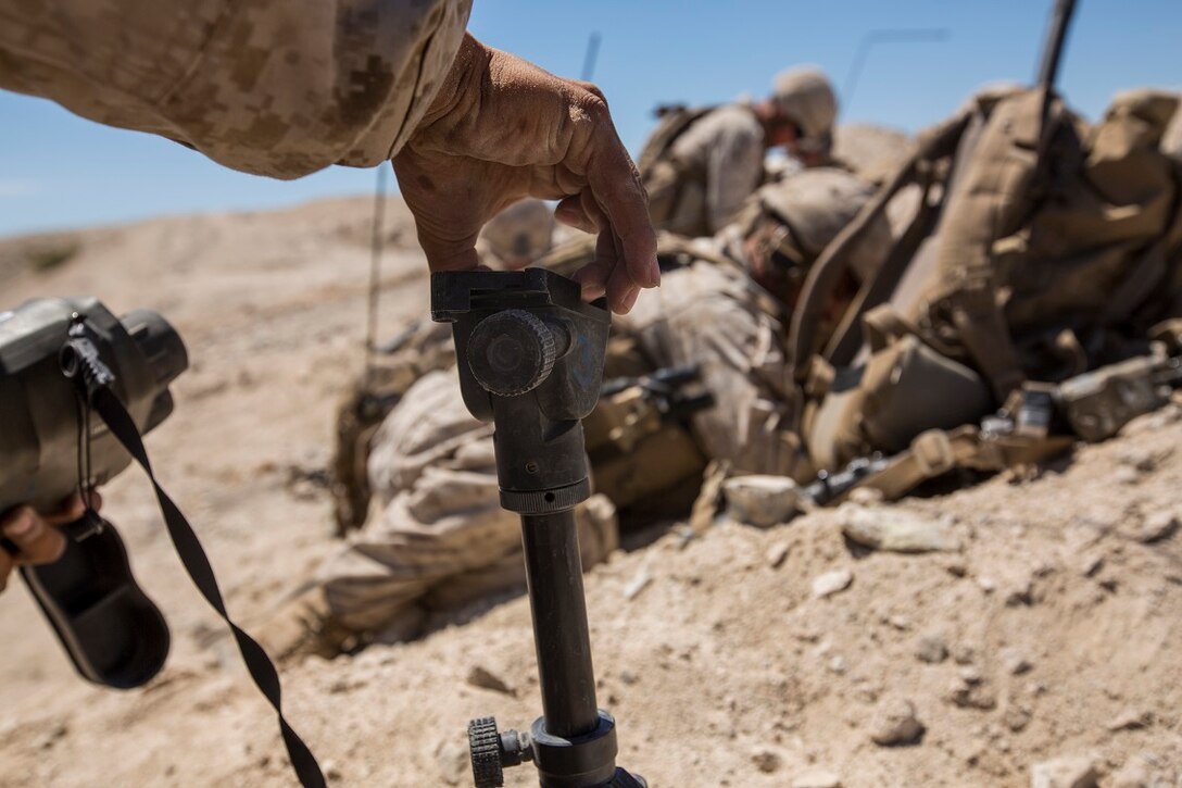 U.S. Marine Corps Lance Cpl. Brian Gomez, with Company C, 1st Battalion, 7th Marine Regiment, arranges a tripod to locate the enemy during fire integration support team (FiST) exercise as a part of Large Scale Exercise (LSE) at Marine Corps Air Ground Combat Center Twentynine Palms, Calif., Aug. 16, 2015. LSE is a joint forces exercise conducted at the brigade level designed to enable live, virtual, and constructive training for participating units and allows participating nations to strengthen partnerships and their ability to operate together. (U.S. Marine Corps photo by Lance Cpl. Clarence A. Leake/Released)