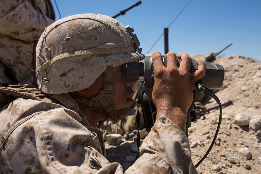 U.S. Marine Corps Lance Cpl. Brian Gomez, with Company C, 1st Battalion, 7th Marine Regiment, locates simulated enemy positions during Large Scale Exercise (LSE) at Marine Corps Air Ground Combat Center Twentynine Palms, Calif., Aug. 16, 2015. LSE is a joint forces exercise conducted at the brigade level designed to enable live, virtual, and constructive training for participating units and allows participating nations to strengthen partnerships and their ability to operate together. (U.S. Marine Corps photo by Lance Cpl. Clarence A. Leake/Released)