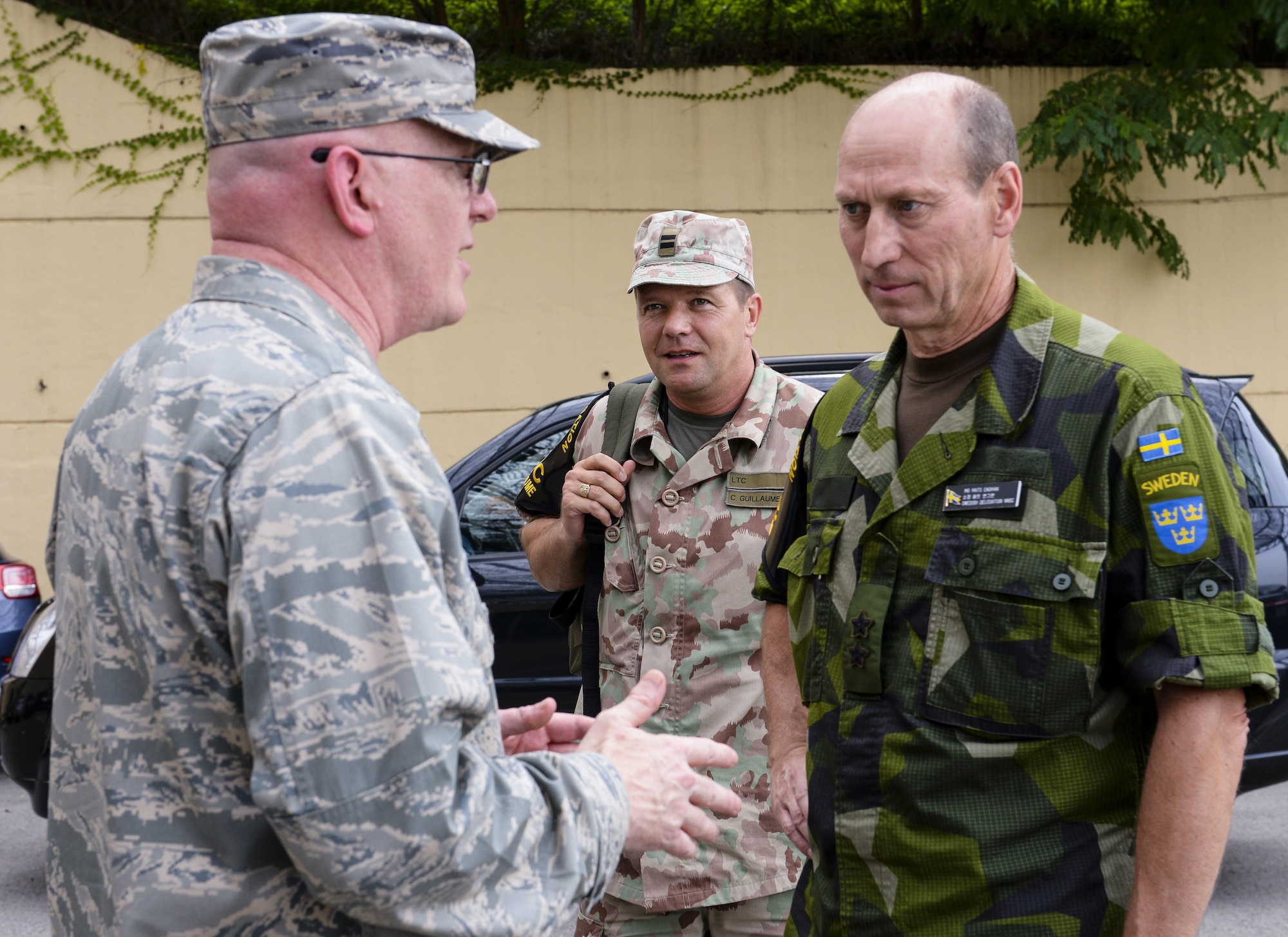 Col. Christopher Cotts, Seventh Air Force chief of staff, greets Swedish Maj. Gen. Mats Engman, right, head of policy and plans department for the Swedish Armed Forces and Swedish Neutral Nations Supervisory Commission member, and Swiss Lt. Col. Christian Guillaume, Swiss delegate to the NNSC, during an observation tour during exercise Ulchi Freedom Guardian Aug. 24, 2015, at Osan Air Base, Republic of Korea.. The NNSC provides transparency to the international community by ensuring planning and operations are conducted with a "defensive and deterrent" nature. (U.S. Air Force photo by Airman 1st Class John Linzmeier/Released)