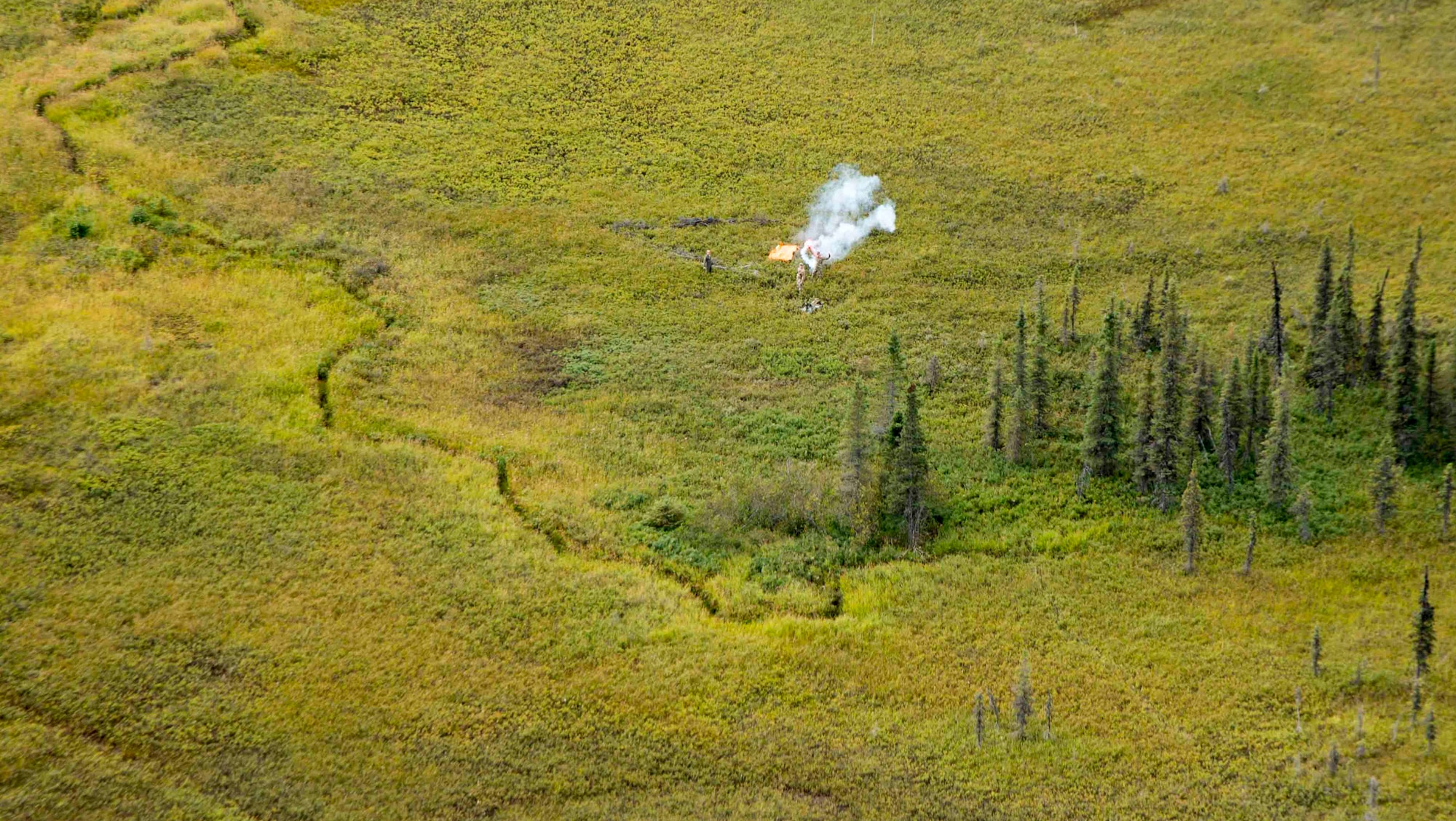A Royal Australian Air Force C-130J scans the area while conducting a search and rescue training mission near Joint Base Elmendorf-Richardson, Alaska, August 25, 2015 during Pacific Airlift Rally. (U.S. Air Force photo/Staff Sgt. Sheila deVera)