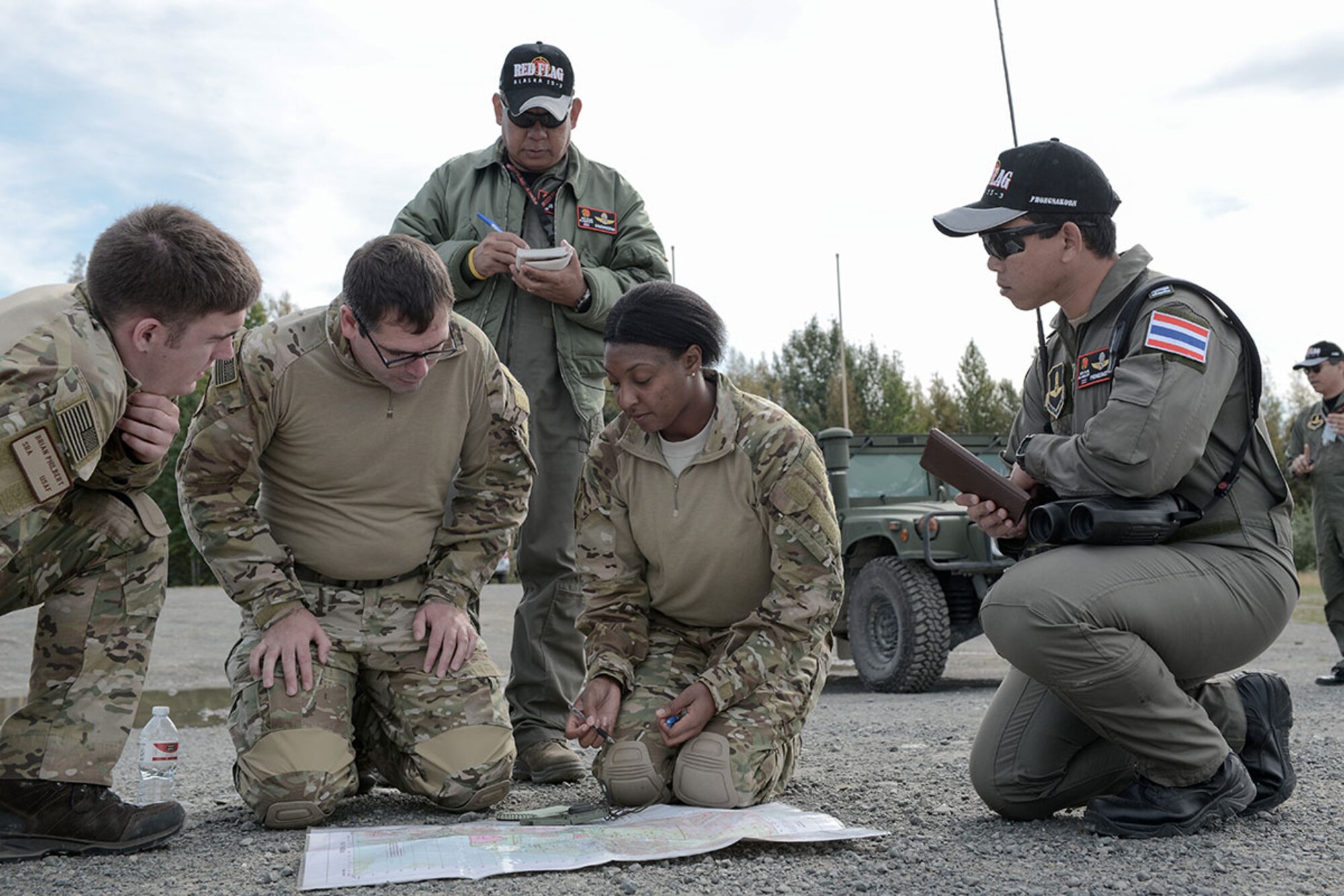 U.S. support and logistics personnel from the 3rd Air Operations Support Squadron work with combat controllers from the Royal Thai Air Force during Red Flag Alaska 15-3. (U.S. Air Force photo/Staff Sgt. Cody Ramirez)
