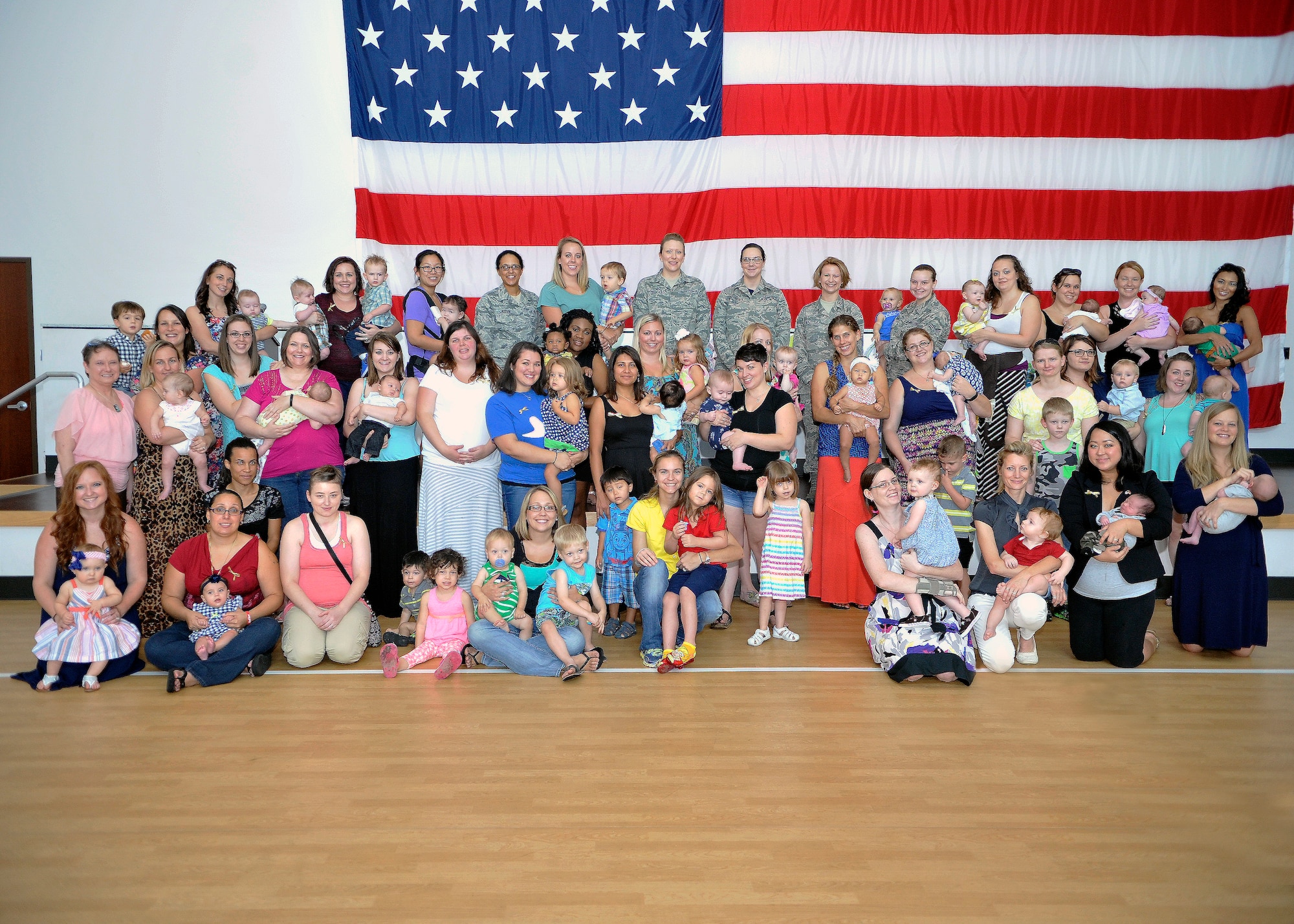 People pose for a group photo August 21, 2015 on Luke Air Force Base, Arizona. Luke held its first Breastfeeding Awareness Luncheon to show support for breastfeeding and a mother’s right to choose. Certificates of appreciation were handed out for mothers who are committed to breastfeeding. Prizes and food were donated to the luncheon. (U.S. Air Force photo by Senior Airman Marcy Copeland)