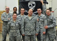 The 341st Missile Wing’s Global Strike Challenge 2015 munitions team poses for a team photo Aug. 26, 2015, at Malmstrom Air Force Base, Mont. From right to left are Senior Airman Matthew Gish; Senior Airman Matthew Glenn, bay chief; Senior Airman Megan Dees; Senior Airman Andrew Matthews; Tech. Sgt. Robert DeMarino, team trainer; Senior Airman Joshua Cox; and Staff Sgt. Aaron Hayworth, team chief. All are from the 341st Munitions Squadron. The MUNS team will compete Sept. 2-4 at Malmstrom’s weapons storage area, and scores will be revealed in October against similar teams from Minot AFB, N.D., and F.E. Warren AFB, Wyo. (U.S. Air Force photo/John Turner)