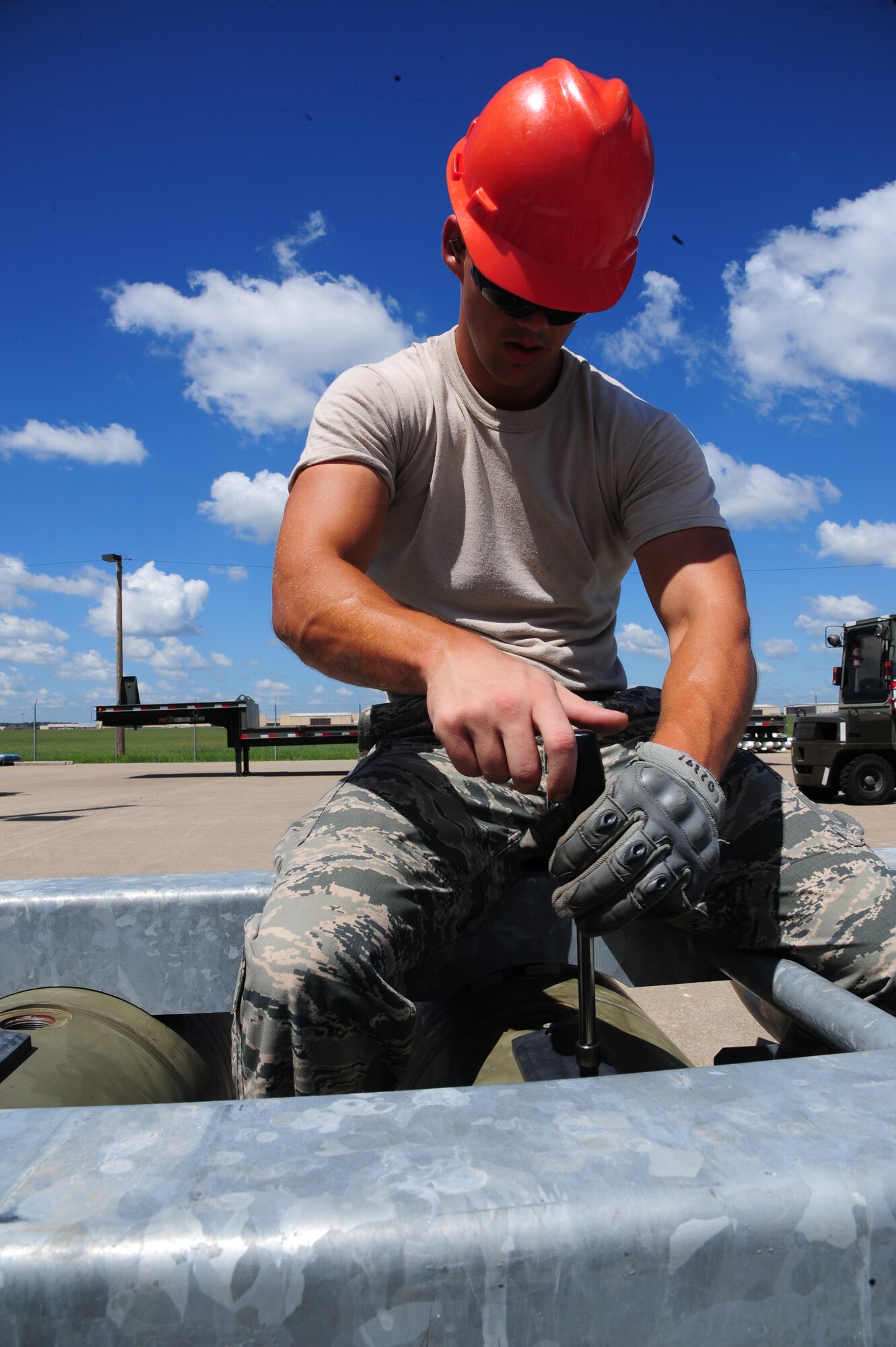 U.S. Airman 1st Class Tyler McLelland, 509th Munitions Squadron conventional maintenance journeyman, removes the shipping plate from a BLU-109 at Whiteman Air Base, Mo., Aug. 11, 2015. This procedure is done to initiate the installation of the bomb fin and hardback assembly. (U.S. Air Force photo by Senior Airman Keenan Berry/Released)