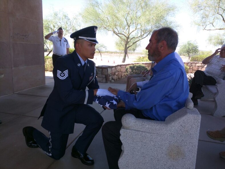 Tech. Sgt. Richard Galero, 56th Force Support Squadron Luke Air Force Base Honor Guard NCO in charge, hands off a flag during a funeral honors ceremony at the National Memorial Cemetery, Arizona 2015. Galero trains and mentors Airmen in the Base Honor Guard. Prior to Honor Guard, he was a maintenance analyst. (Courtesy Photo) 