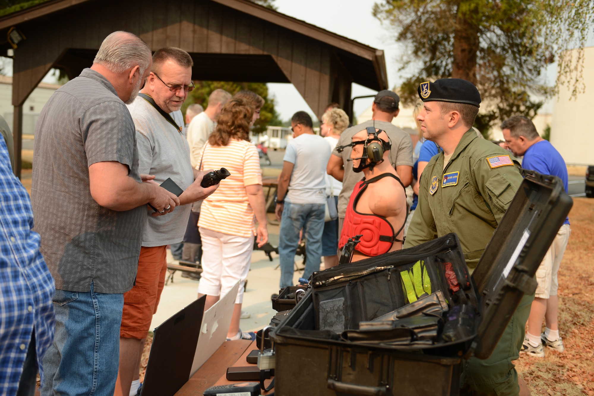 Staff Sgt. Justin Winstead, 627th Security Forces Sqauadron Phoenix Raven team leader, shows equipment to members of the McChord Pathfinder Aug. 22, 2015, on Joint Base Lewis-McChord, Wash. The McChord Pathfinders are a group of retired security forces Airmen that were once stationed at JBLM. (U.S. Air Force photo/Airman 1st Class Keoni Chavarria)