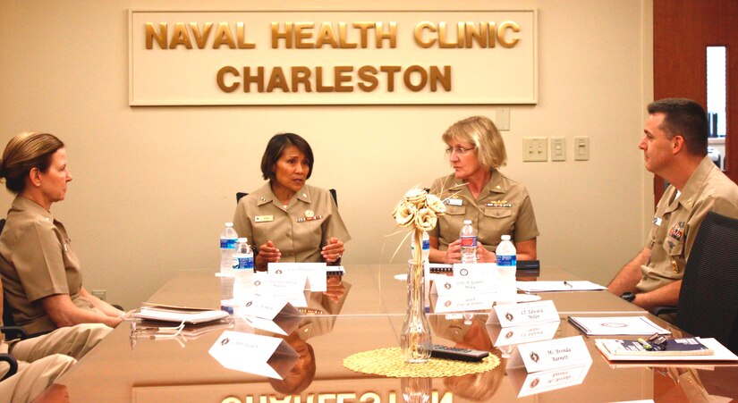 Rear Adm. Raquel Bono, chief, Navy Medical Corps and director, National Capital Region Medical Directorate, discusses the future of military medicine with Capt. Elizabeth Maley, commanding officer of Naval Health Clinic Charleston (right); NHCC Executive Officer Capt. Rosemary Malone (left); and NHCC Command Master Chief Robert Mile, Aug. 21, during Bono's visit to NHCC. Bono's visit at NHCC was one stop on her two-week tour of military treatment facilities. (Navy photo/ Hospitalman Mark Simon)
