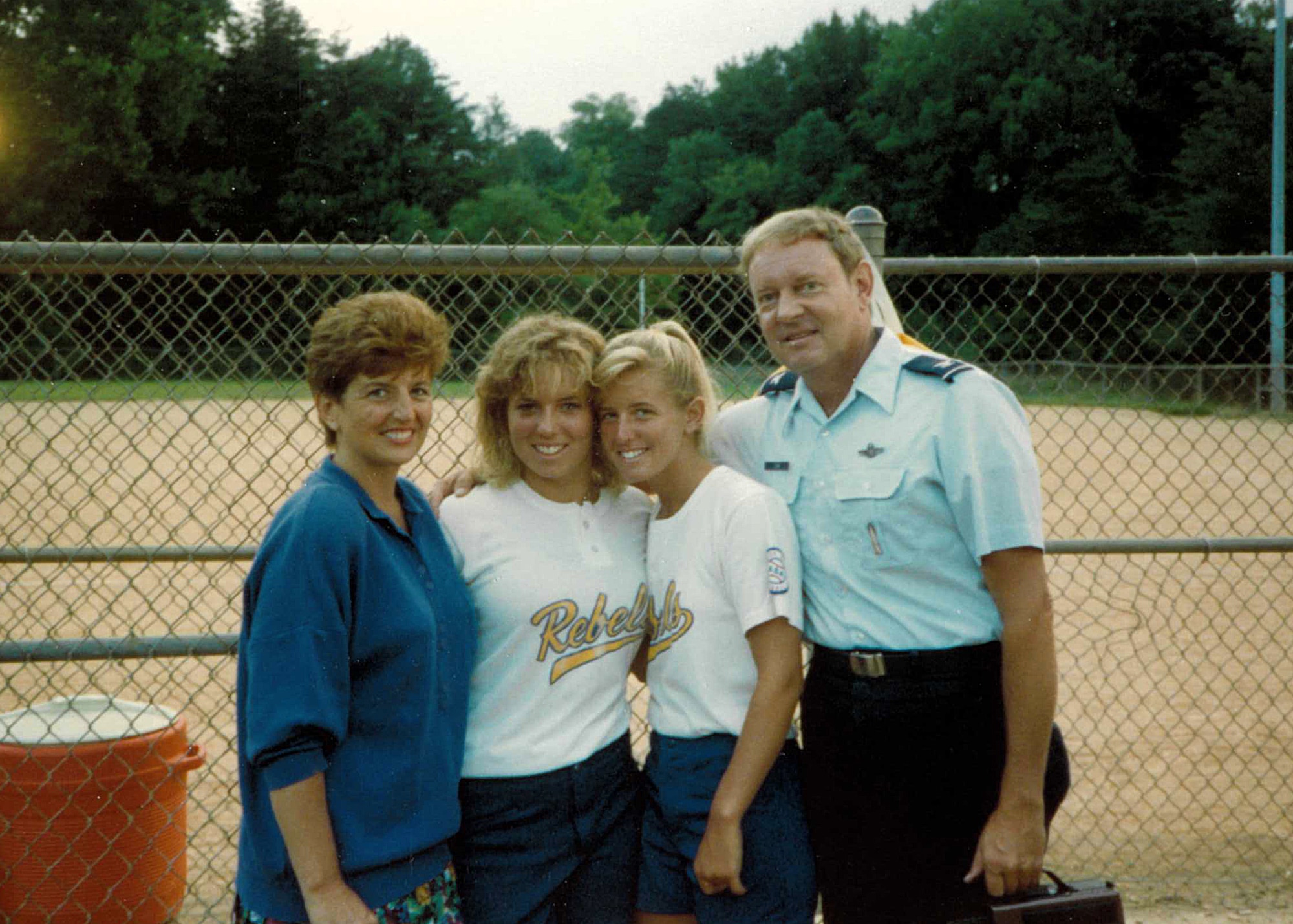 Col. Laura Lenderman, with her mom, Marilou, dad, Col. Gordon Cook, and sister Kristin Cook. Now the 375th Air Mobility Wing commander, Lenderman said her love of sports were framed at Scott Air Force Base, Illinois, when her father was stationed there in the early 1980s. (Courtesy photo)