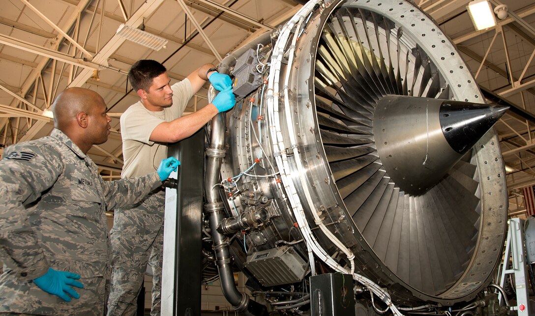 U.S. Air Force Staff Sgt. Freddie Metcalf, 362nd Training Squadron instructor, familiarizes Airman 1st Class William Walter with the KC-135 Stratotanker engine widely used on approximately 737 aircraft, Aug. 25, 2015, at Sheppard Air Force Base, Texas. Instructors teach students the basics of working on every aircraft maintenance subject there is to ensure cargo, weapons and flight crew make it to their destinations accurately and safely. (U.S. Air Force photo by Danny Webb/Released)