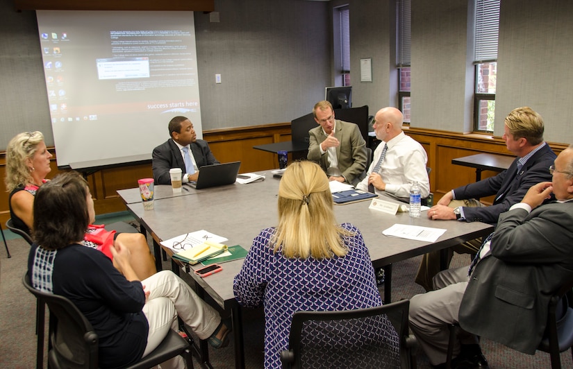 A Working Group discusses the values, benefits and challenges of a specific topic during the Air Force Community Partnership Program Joint Base Charleston Tabletop Exercise, August 26, 2015 at Trident Tech College in North Charleston, S.C. The purpose of the exercise was to leverage installation and local community capabilities and resources to identify and develop mutually beneficial partnerships to increase efficiency, retain or enhance quality and reduce operating and service costs or reduce risks. (U.S. Air Force photo/Staff Sgt. AJ Hyatt)