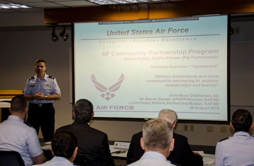 Lt. Col. Ralph Taylor, 628th Mission Support Group deputy commander, begins the Air Force Community Partnership Program Joint Base Charleston Tabletop Exercise, August 26, 2015 at Trident Tech College in North Charleston, S.C. The JB Charleston TTX was the culmination of several planning meetings where a core group of installation and community leaders shared information on existing partnerships, organizational needs and capabilities/resources and identified potential partnering opportunities to reduce operating and service costs or reduce risks, while retaining or enhancing quality. The exercise served as a forum for members of the installation and local communities to engage in focused discussions related to the concept of partnering and clearly identify the next steps required to make the opportunities become reality. (U.S. Air Force photo/Staff Sgt. AJ Hyatt)