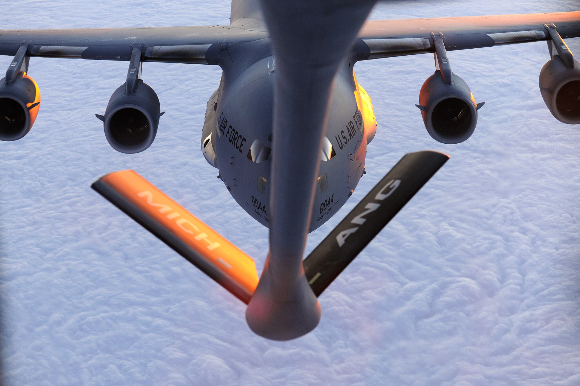 150825-Z-EZ686-067 -- A KC-135 Stratotanker from the 171st Air Refueling Squadron, Selfridge Air National Guard Base, Mich., refuels a C-17 Globemaster III from the 445th Airlift Wing during a training mission on Aug. 25, 2015. The KC-135 Stratotanker is operated by the 127th Air Refueling Group, flown by the 171st Air Refueling Squadron and maintained by the 191st Maintenance and 191st Aircraft Maintenance squadrons. (U.S. Air National Guard photo by Master Sgt David Kujawa / Released)
