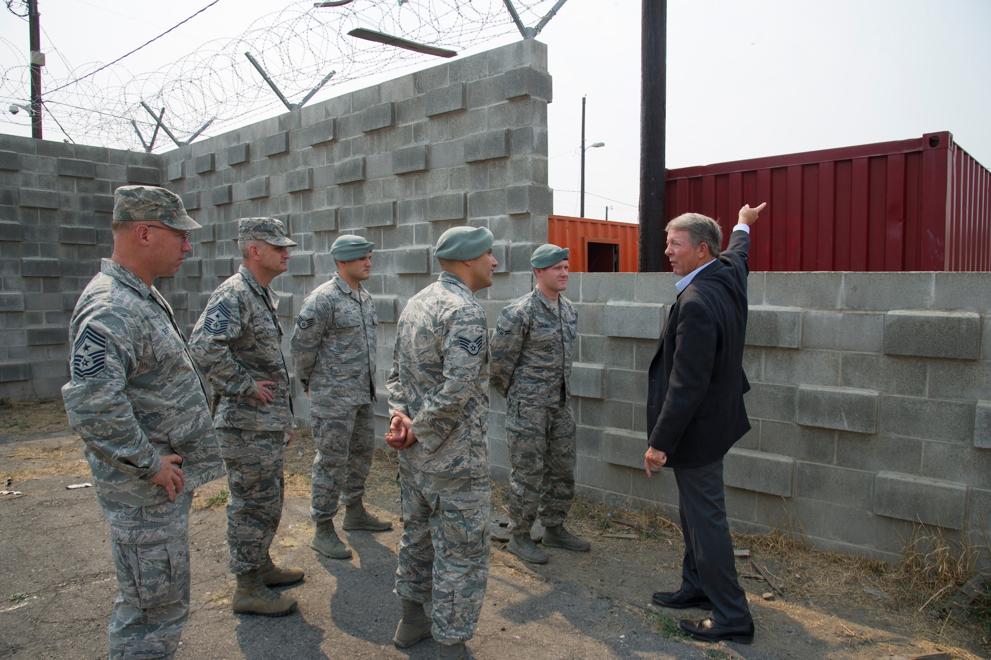 Fifteenth Chief Master Sgt. of the Air Force Rodney McKinley tours the Urban Evasion Laboratory Aug. 21, 2015, at Fairchild Air Force Base, Wash. Survival, Evasion, Resistance, and Escape specialists ran McKinley through the UEL and spoke about the importance of SERE training to downed aircrew personnel. (U.S. Air Force photo/Airman 1st Class Nicolo J. Daniello)