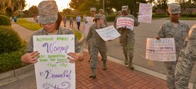 Joint Base Charleston Airmen march together for national Women’s Equality Day at JB Charleston, SC, Aug. 26, 2015. Women’s Equality Day began in 1972, where it was originally called Women’s Rights Day. (U.S. Air Force photo/Airman 1st Class Thomas T. Charlton) 