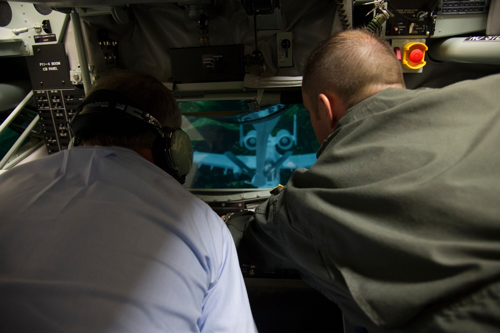Tech. Sgt. Dan McCrillis, 92nd Air Refueling Squadron boom operator, shows 15th Chief Master Sgt. of the Air Force Rodney McKinley how to operate the boom simulator Aug. 21, 2015, at Fairchild Air Force Base, Wash. McKinley got a hands-on experience with the boom simulator to see what it is like to be a boom operator during his visit to Fairchild. (U.S. Air Force photo/Airman 1st Class Nicolo J. Daniello)