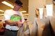 Richard Lubke, a retired Air Force flight engineer, examines a Feds Feed Families food bag in the commissary at Holloman Air Force Base on Aug 18. For less than $10, commissary shoppers, like Lubke, can help feed a  local family in need. (U.S. Air Force photo by Amn Randahl J. Jenson)