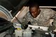 Senior Airman Joseph Bates, 90th Logistics Readiness Squadron Traffic Control Function controller, checks a vehicle’s fluid levels Aug. 5, 2015, on F.E. Warren Air Force Base, Wyo. Bates and his fellow TCF controllers often help out day shift vehicle operations Airmen by checking vehicles in addition to their TCF duties. (U.S. Air Force photo by Senior Airman Jason Wiese)