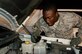 Senior Airman Joseph Bates, 90th Logistics Readiness Squadron Traffic Control Function controller, checks a vehicle’s fluid levels Aug. 5, 2015, on F.E. Warren Air Force Base, Wyo. Bates and his fellow TCF controllers often help out day shift vehicle operations Airmen by checking vehicles in addition to their TCF duties. (U.S. Air Force photo by Senior Airman Jason Wiese)