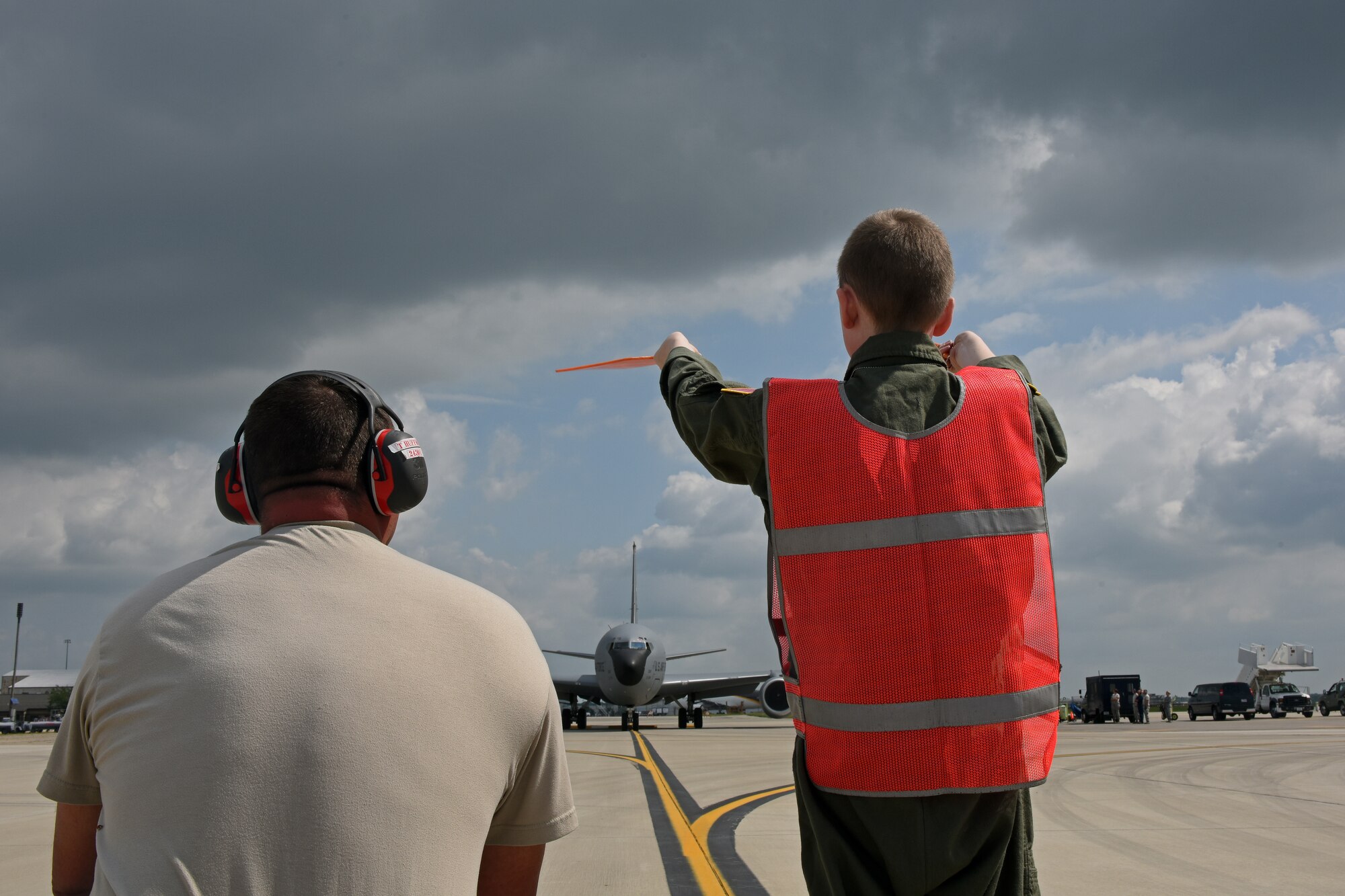 Jake Sprowl, a 12-year-old from Springfield, Ohio, marshalls a KC-135R Stratotanker on the flightline, Aug. 11, 2015 at Rickenbacker Air National Guard Base. Sprowl was the honorary Pilot for a Day and spent the day with Airmen of the 121st Air Refueling Wing, touring the base and learning about the missions of the various squadrons. (U.S. Air National Guard photo by Airman Ashley Williams/Released)