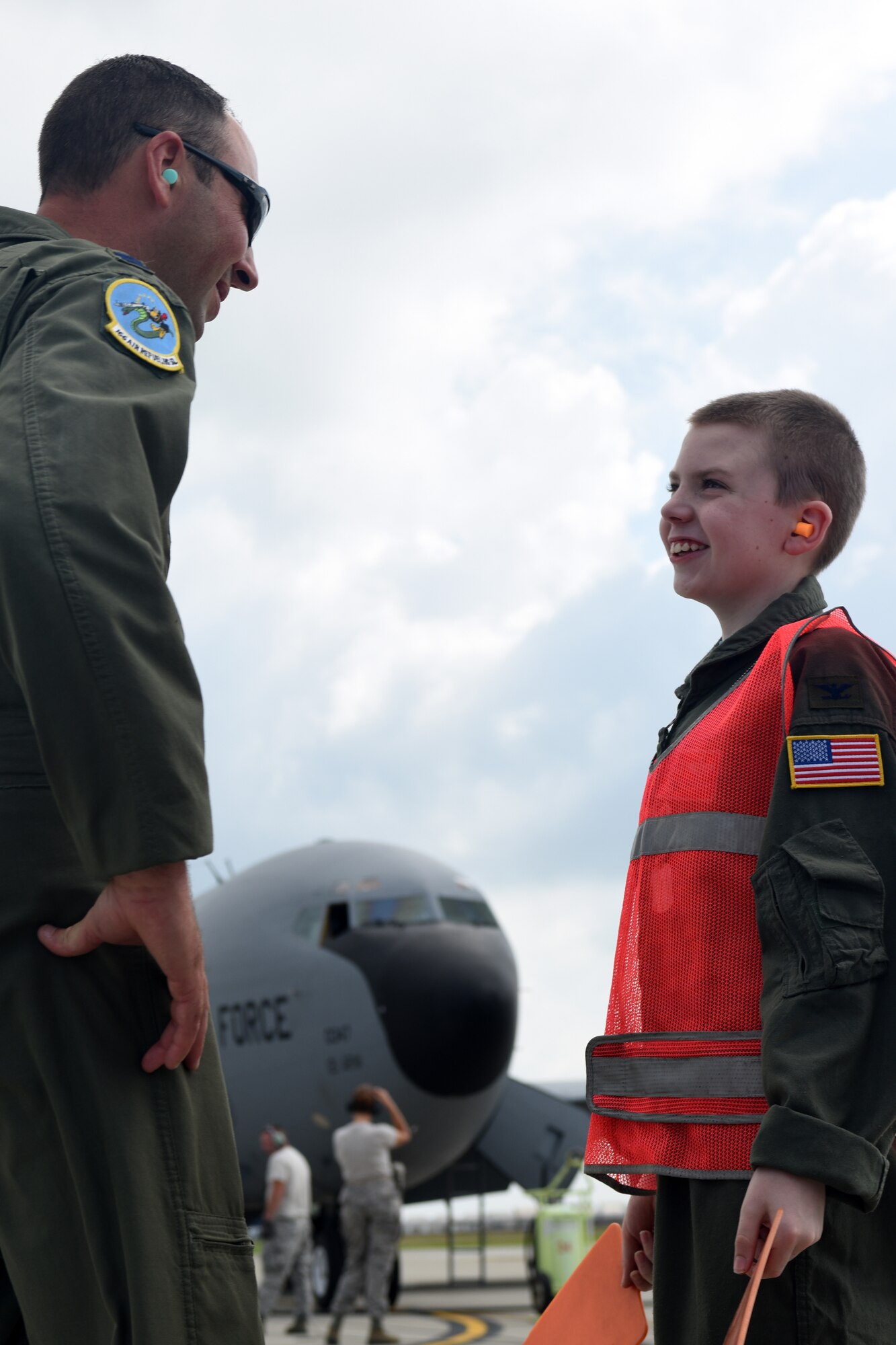 U.S. Air Force Capt. Jacob Allen, a pilot with the 121st Air Refueling Wing, talks with Pilot for a Day, Jake Sprowl, a 12-year-old from Springfield, Ohio, Aug. 11, 2015 at Rickenbacker Air National Guard Base. Sprowl and his family spent the day with Airmen of the 121st Air Refueling Wing, touring the base and learning about the missions of the various squadrons. (U.S. Air National Guard photo by Airman Ashley Williams/Released)