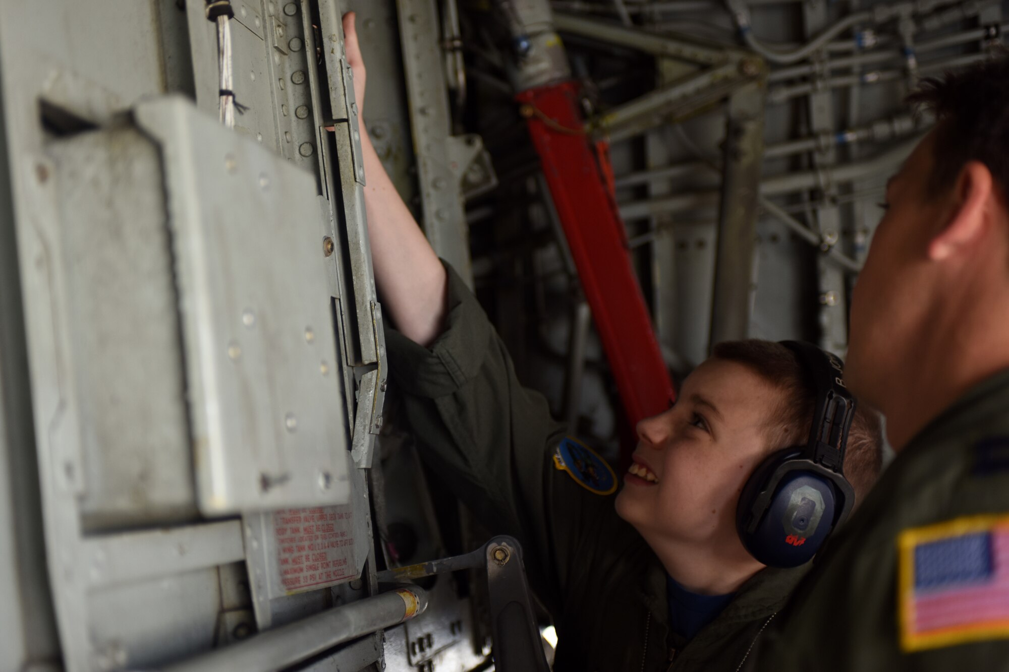 U.S. Air Force Capt. Adam Adair, a pilot with the 121st Air Refueling Wing, runs through a pre-flight inspection with Pilot for a Day, Jake Sprowl, a 12-year-old from Springfield, Ohio, Aug. 11, 2015 at Rickenbacker Air National Guard Base, Ohio. Sprowl and his family spent the day with Airmen of the 121st Air Refueling Wing, touring the base and learning about the missions of the various squadrons. (U.S. Air National Guard photo by Airman Ashley Williams/Released)
