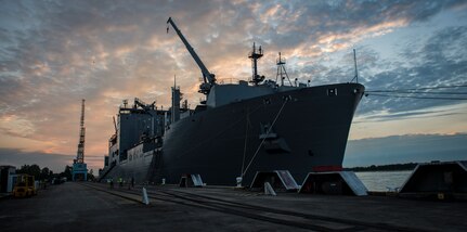The USNS Lewis and Clark (T-AKE-1) waits for a cargo upload while docked March, 25, 2015, at Naval Weapons Station Wharf Alpha, Charleston, S.C. The Lewis and Clark is a replenishment naval vessel. In 2012, USNS Lewis and Clark became one of 12 ships that comprise the United States Marine Corps Maritime Prepositioning Program. Prepositioning ships provides quick and efficient movement of military equipment/supplies between operating areas without reliance on other nations' transportation networks. These ships assure U.S. regional combatant commanders they will have what they need to quickly respond in a crisis - anywhere, anytime. (U.S. Air Force photo/Airman 1st Class Clayton Cupit)