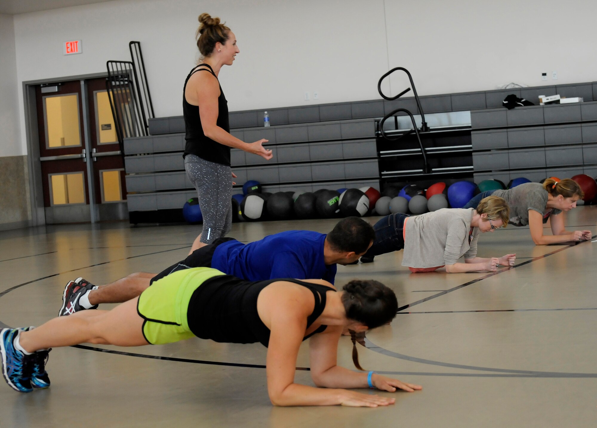 Sara Coleman leads a Cross Fit class for parents during the Back2School Bash at Camp Withycombe, Ore., Aug. 22, 2015. (U.S. Air National Guard photo by Tech. Sgt. John Hughel, 142nd Fighter Wing Public Affairs/Released)
