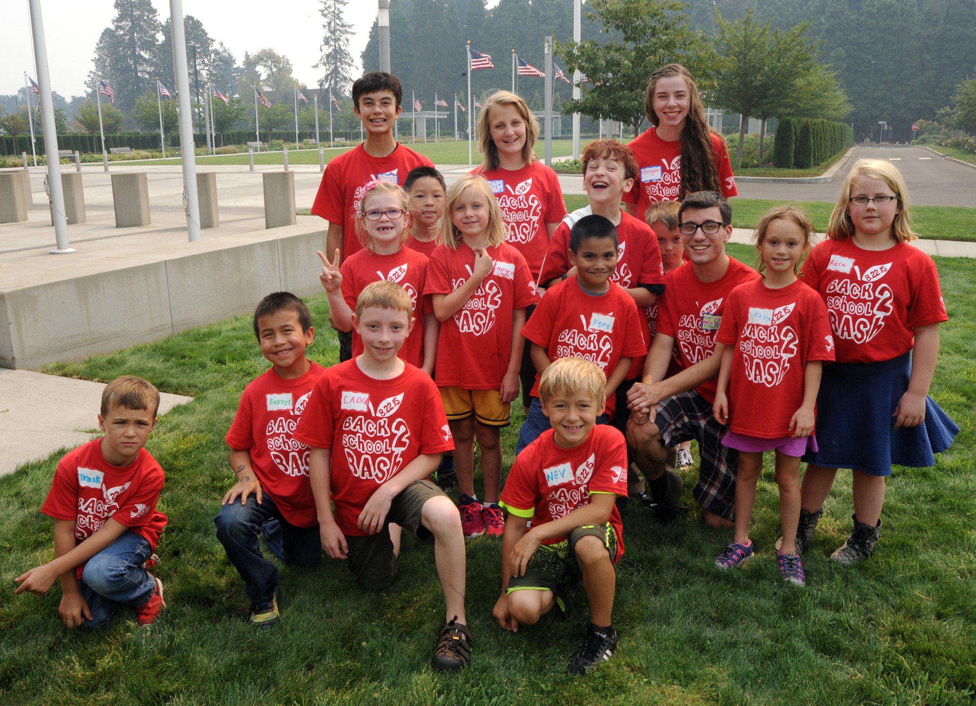 Oregon Military Teen Panel members along with younger participants gather for a group photograph at Camp Withycombe, Ore., during the Back2School Bash, Aug. 22, 2015. (U.S. Air National Guard photo by Tech. Sgt. John Hughel, 142nd Fighter Wing Public Affairs/Released)