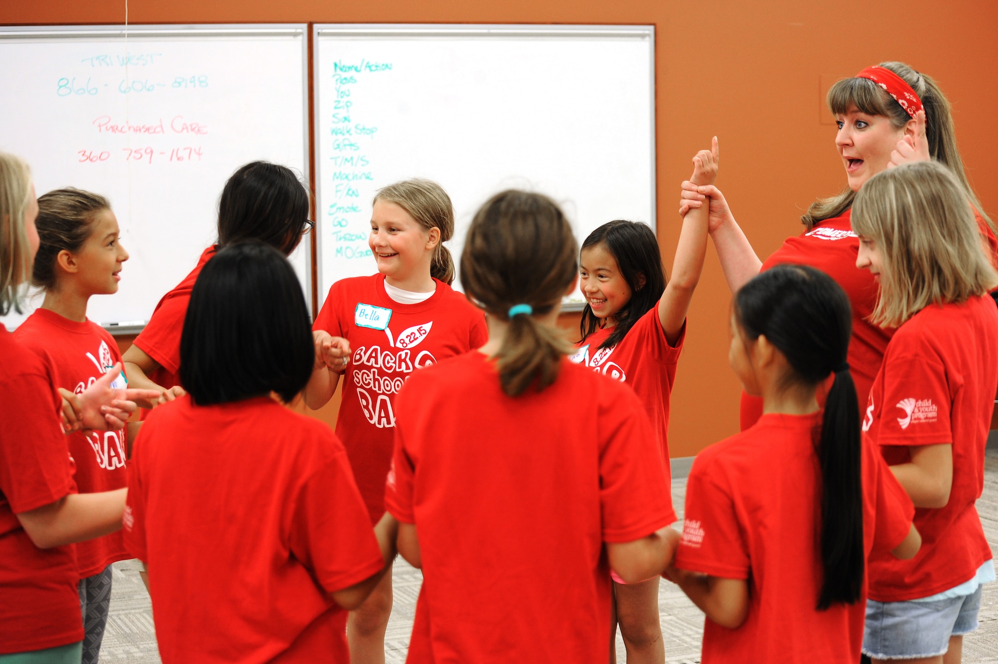 Jenn Hunter, left, an actress with Comedy Sportz, leads a group of military youth during the Back2School Bash at Camp Withycombe, Ore., Aug. 22, 2015. (U.S. Air National Guard photo by Tech. Sgt. John Hughel, 142nd Fighter Wing Public Affairs/Released)
