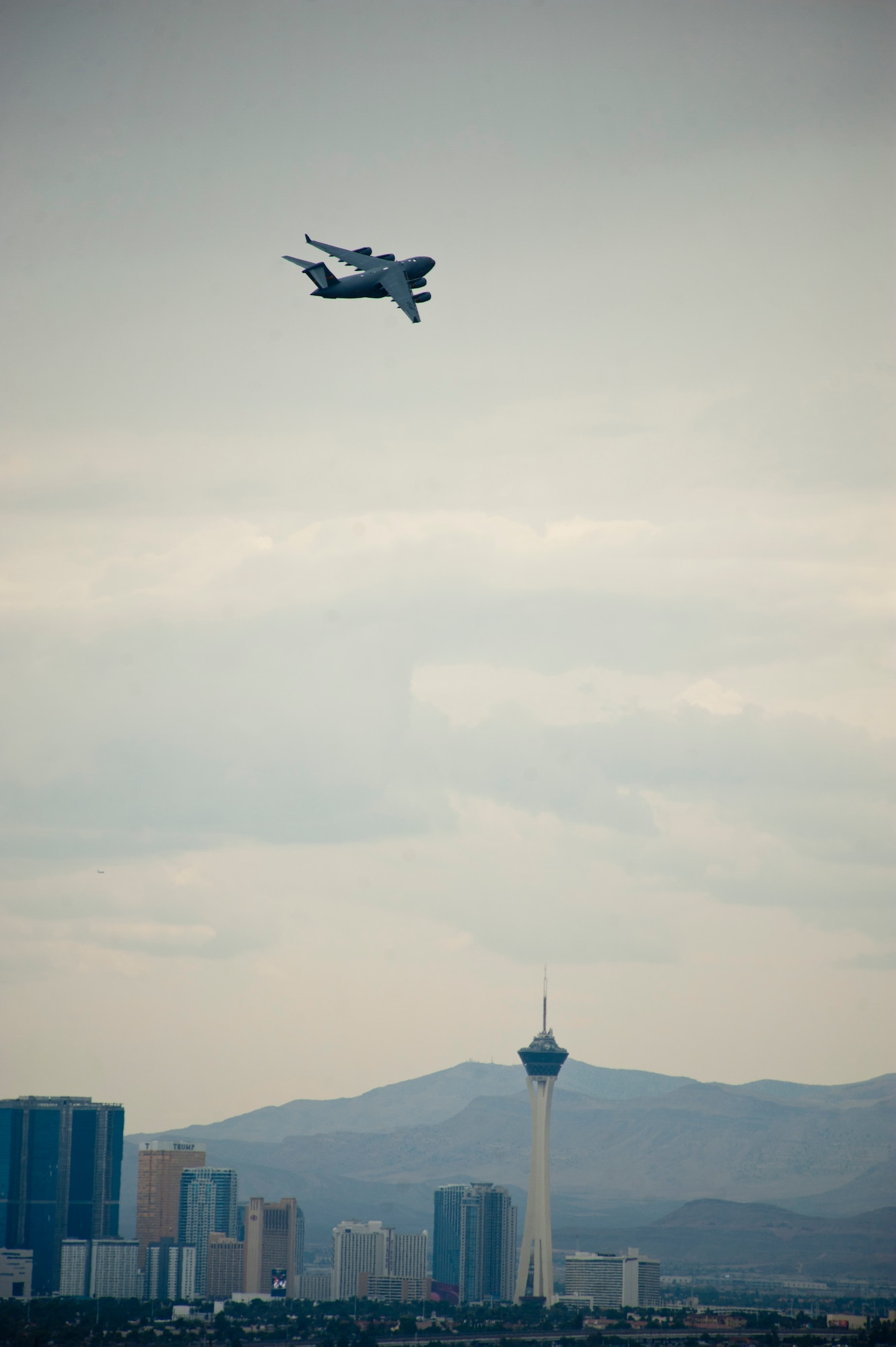 A C-17 Globemaster III assigned to the 437th Airlift Wing, Charleston Air Force Base, S.C., flies to the Nevada Test and Training Range during Red Flag 15-4, Aug. 25, 2015. With a range of over 2,500 miles, the C-17 is capable of carrying 102 troops or paratroopers or 170,900 pounds of cargo at a service ceiling of 45,000 feet. (U.S. Air Force photo by Senior Airman Thomas Spangler) 