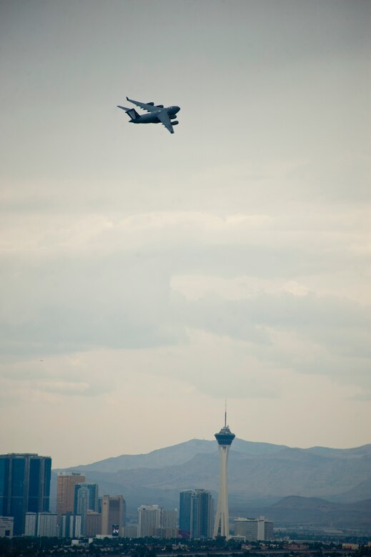 A C-17 Globemaster III assigned to the 437th Airlift Wing, Charleston Air Force Base, S.C., flies to the Nevada Test and Training Range during Red Flag 15-4, Aug. 25, 2015. With a range of over 2,500 miles, the C-17 is capable of carrying 102 troops or paratroopers or 170,900 pounds of cargo at a service ceiling of 45,000 feet. (U.S. Air Force photo by Senior Airman Thomas Spangler) 