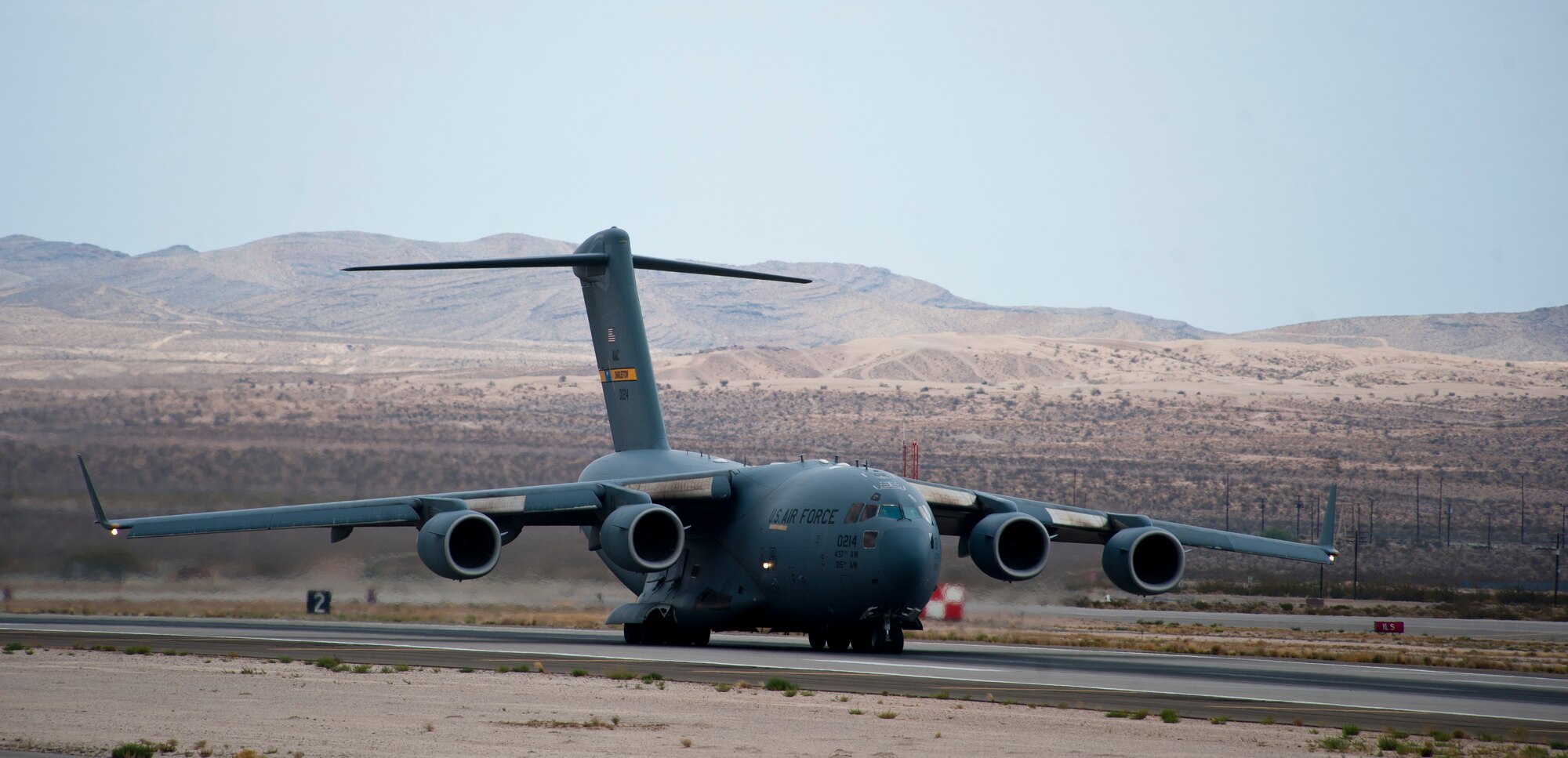 A C-17 Globemaster III assigned to the 437th Airlift Wing, Charleston Air Force Base, S.C., prepares to take off during Red Flag 15-4 at Nellis AFB, Nev., Aug. 25, 2015. A typical Red Flag exercise involves a variety of attack, fighter, bomber, electronic warfare, reconnaissance, recue, aerial refueling and airlift support aircraft. (U.S. Air Force photo by Senior Airman Thomas Spangler)
