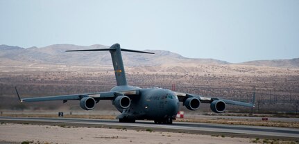A C-17 Globemaster III assigned to the 437th Airlift Wing, Charleston Air Force Base, S.C., prepares to take off during Red Flag 15-4 at Nellis AFB, Nev., Aug. 25, 2015. A typical Red Flag exercise involves a variety of attack, fighter, bomber, electronic warfare, reconnaissance, recue, aerial refueling and airlift support aircraft. (U.S. Air Force photo by Senior Airman Thomas Spangler)