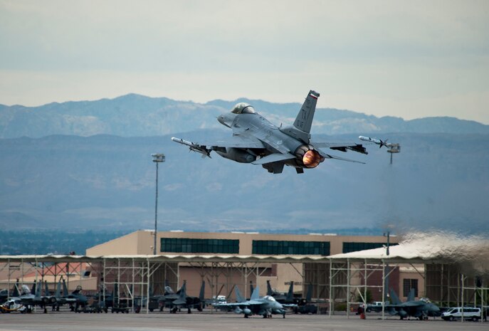 An F-16 Fighting Falcon assigned to the 457th Fighter Squadron, Naval Air Station Fort Worth Joint Reserve Base, Texas, takes off during Red Flag 15-4 at Nellis Air Force Base, Nev., Aug. 25, 2015. All four U.S. military services, their Guard and Reserve components and the air forces of other countries participate in each Red Flag exercise. (U.S. Air Force photo by Senior Airman Thomas Spangler)