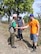 Kamal Jung Kunwar, chief conservation officer and author, greets U.S. Air Force Tech. Sgt. Scott Bettencourt, a pharmacy flight chief with the 55th Medical Support Squadron, while visiting with volunteers building working elephant corrals in Chitwan National Park, Nepal.  An international crew of volunteers came to Chitwan to build the corrals that will replace the chains elephants were tethered to in their off time. (photo courtesy of Elephant Aid International)