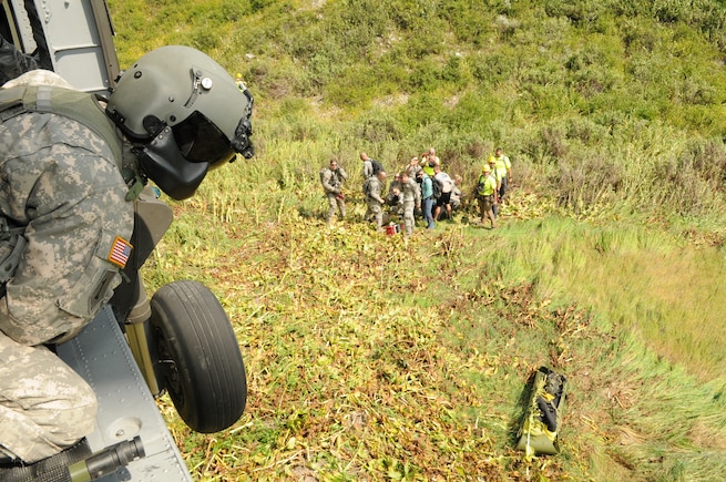 Utah Army and Air National Guard members participate in a multi-agency medevac training scenario with Davis County Search and Rescue near the Beaver Ponds in Utah's Farmington Canyon on Aug. 16, 2015. (U.S. Air National Guard photo by Tech. Sgt. Amber Monio/Released)