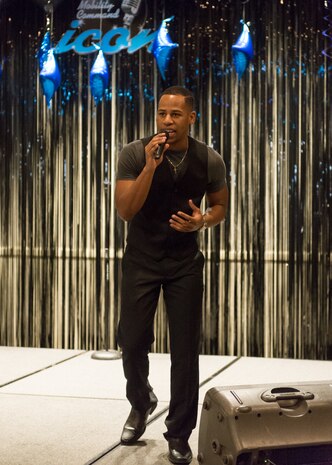 Senior Airman Calvin Johnson, 628th Security Force Squadron will move onto the AMC-level competition of AMC Icon after placing as the highest scored active duty Air Force participant. Eight Joint Base Charleston members competed in the signing competition held at the Charleston Club, Aug. 20. AMC Icon is loosely based on American Idol where service members, Department of Defense civilians and family members ages 18 and older compete for cash prizes. Johnson performed "Unbreakable" by Alicia Keys. (Courtesy photo / Maj. Julie Johnson, 628th Medical Group) 