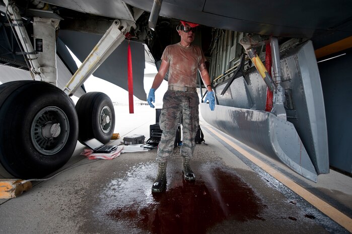 Staff Sgt. David Atteberry, an aircraft hydraulic systems technician assigned to the 92nd Aircraft Maintenance Squadron, Fairchild Air Force Base, Wash., takes a moment to look over his work after replacing a KC-135 Stratotanker’s hydraulic system relief valve that covered him in hydraulic fluid during Red Flag 15-4 at Nellis AFB, Nev., Aug. 25, 2015. Aircraft hydraulic system specialists are responsible for everything that deals with hydraulic and pneumatic systems, including landing gears, brakes, flight controls, weapons and cargo door systems. (U.S. Air Force photo by Staff Sgt. Siuta B. Ika)