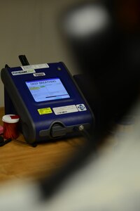 A gas mask fit-test monitor collects examination data in the bioenvironmental office at Langley Air Force Base, Va., Aug. 18, 2015. During the test, U.S. Service members must demonstrate several breathing techniques to find the accurate mask fitting. (U.S. Air Force photo by Senior Airman Kimberly Nagle/Released)
