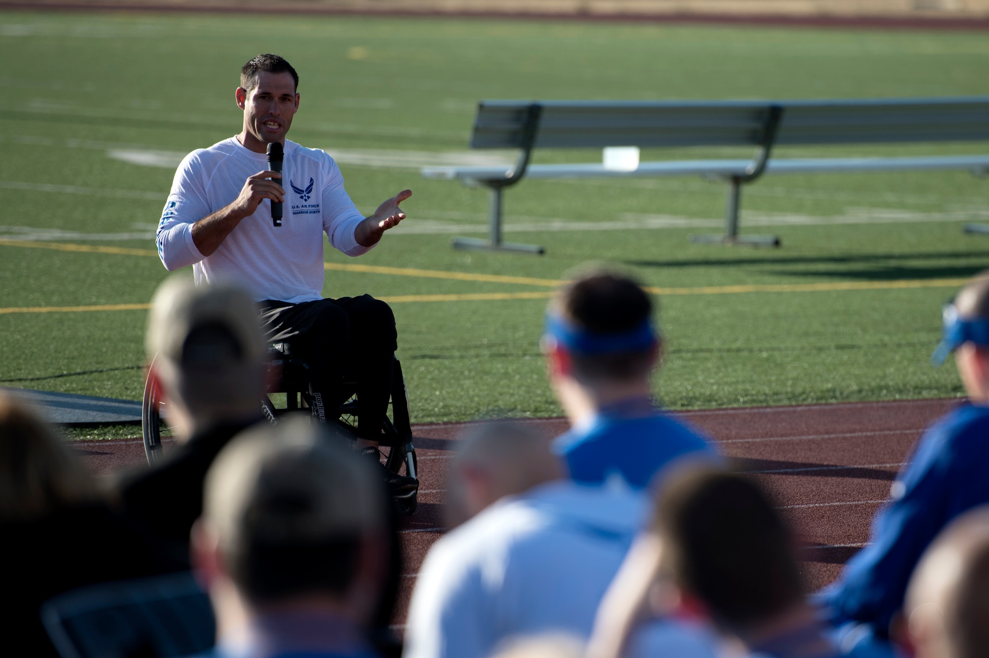 Retired Tech. Sgt. Ryan Penny, Air Force wounded warrior, speaks to fellow wounded warriors at the opening ceremony for the Air Force Wounded Warrior (AFW2) Program Warrior Care event Aug. 25, 2015, at Joint Base Lewis-McChord, Wash. The Warrior Care event features adaptive and rehabilitative sports activities, career readiness, recovering Airman mentorship and caregiver training. (U.S. Air Force photo by Staff Sgt. Ashley Hyatt)