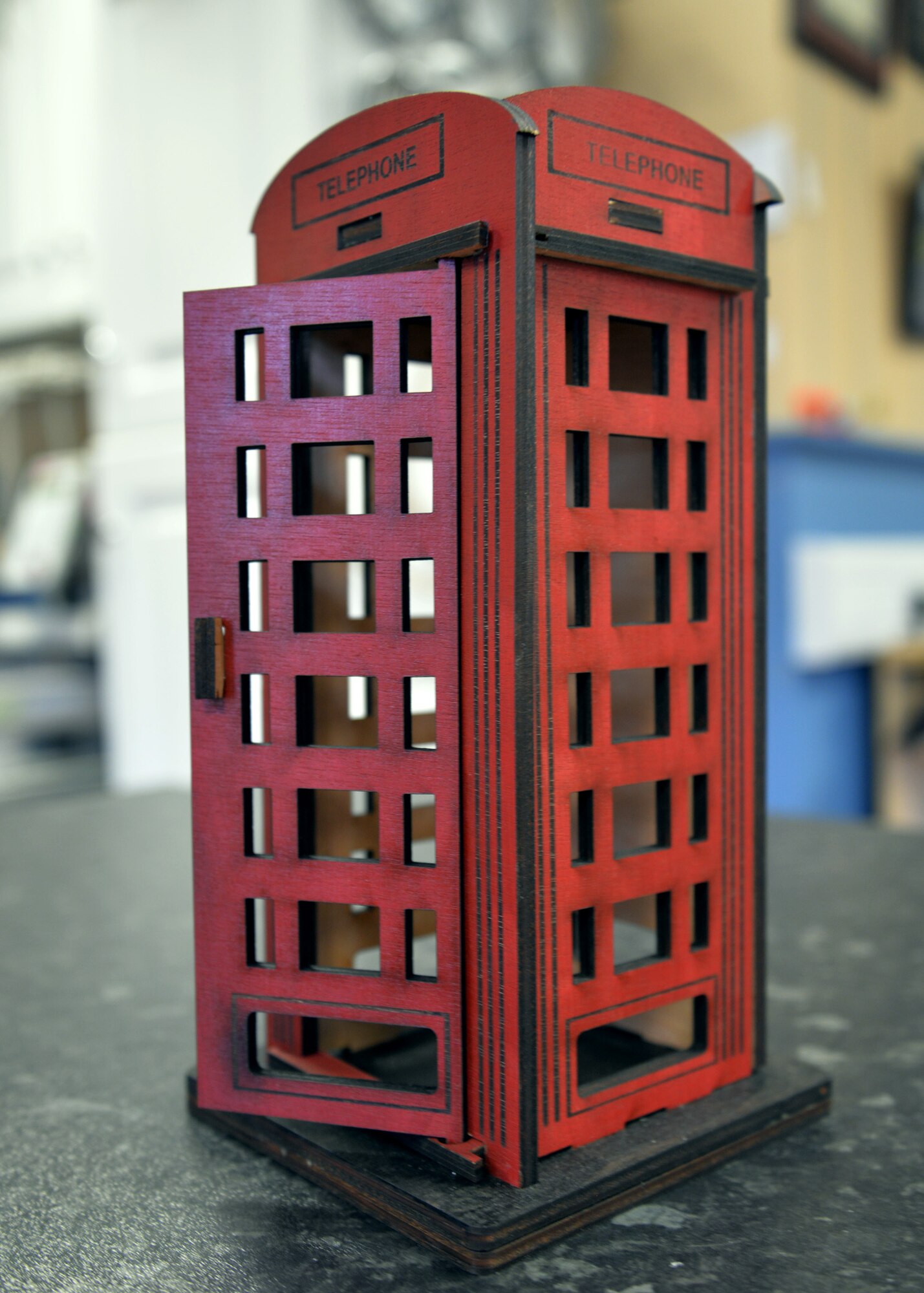 A wooden British telephone box is just one of many items created by the 100th Force Support Squadron Arts and Crafts facility. Customers can personalize the phone box in several ways, including with an engraved plaque or coin inset into the base or top. The arts and crafts staff can create items using a laser machine. (U.S. Air Force photo by Karen Abeyasekere/Released)