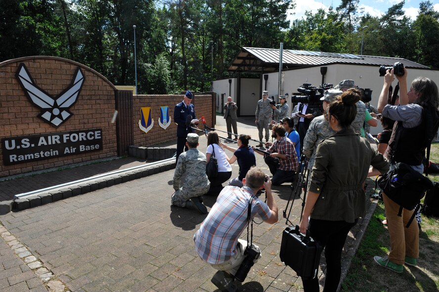 Lt. Col. Richard Smith, 65th Air Base Group Medical Operations and Support Squadron commander at Lajes Field, Azores, held a press conference on Aug. 26, at the west gate of Ramstein Air Base, Germany. Smith relayed a message from Airman 1st Class Spencer Stone thanking people for their continued support and appreciation after he sustained injuries while subduing a gunman on a French train Aug. 21, 2015. (U.S. Air Force photo/Staff Sgt. Leslie Keopka) 